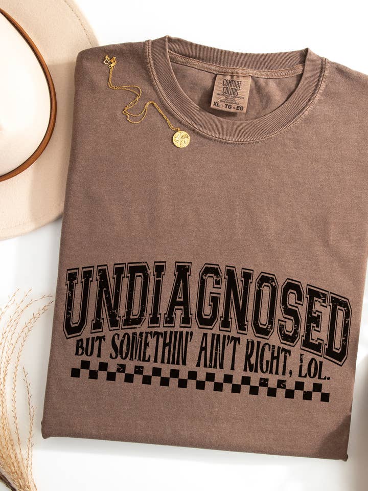 Undiagnosed, Somethin' Ain't Right Graphic Tee for wholesale by CMD Wholesale