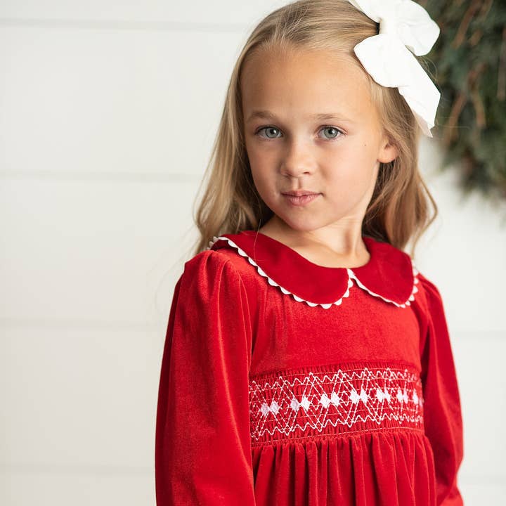 Kids Red Velvet Smocked Lace Peter Pan Winter Holiday Dress and other Purchase Wholesale smocked christmas outfit. Free Returns & Net 60 Terms on Faire trending on Faire.