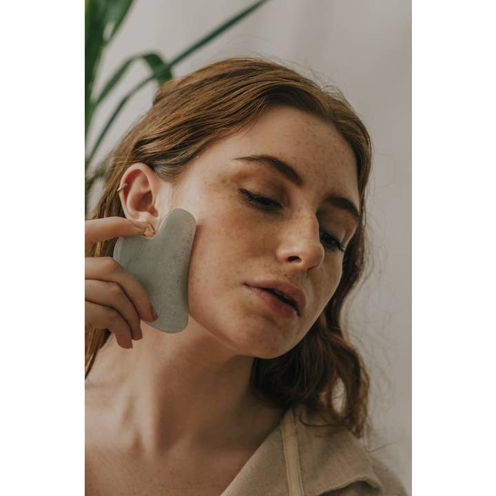 Xander Kostroma - Wholesale Gua Sha Tool - Jade Crystal Gua Sha with Black Skull Pouch