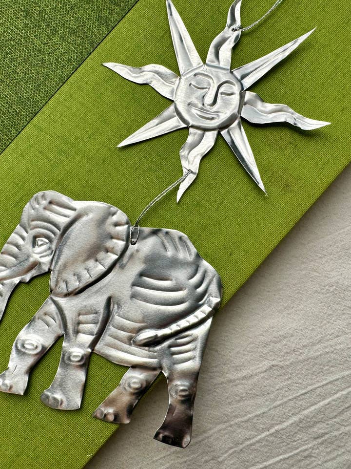 Handmade Embossed Tin Wall Art: Elephant & Sun for wholesale by Foot Range Mountain