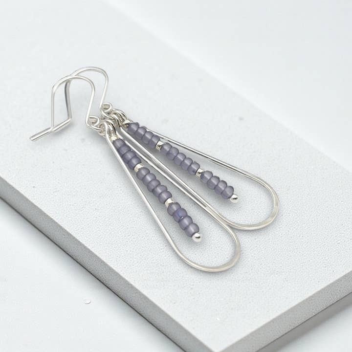 Long Sterling Silver Teardrop Hoop Earrings with Purple Bead for wholesale by Bijou by SAM