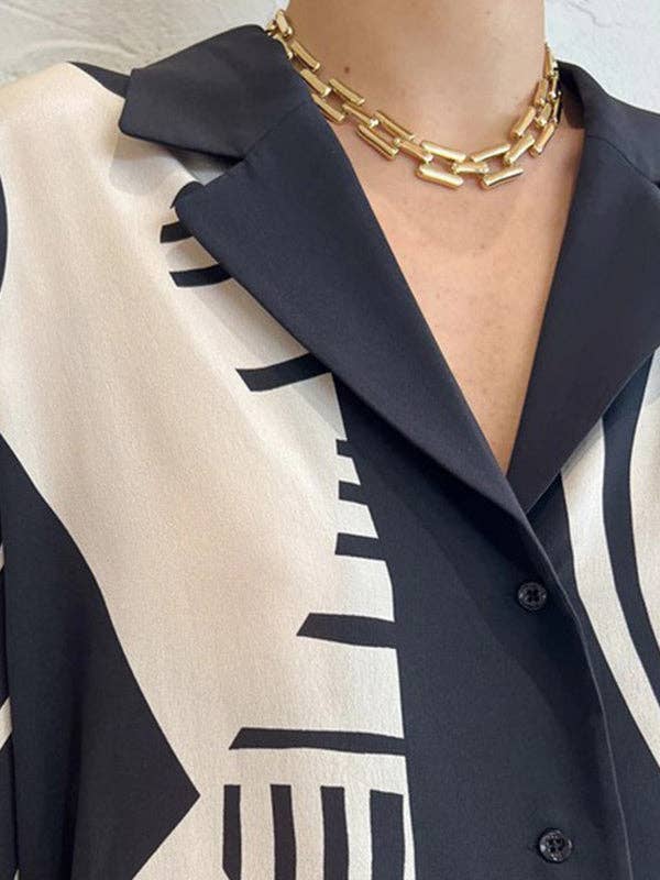 NERO Completo donna con blusa ampia a maniche lunghe e pantaloni con tasche e stampa in vendita all'ingrosso su Faire4