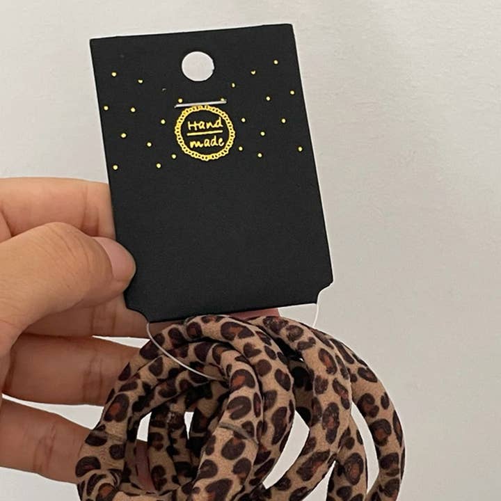 Conjunto de 5 Elásticos para Cabelo com Estampa de Leopardo - Café e outras tendências em Compre elasticos B2B. Devoluções gratuitas e condições de pagamento a 60 dias na Faire na Faire.