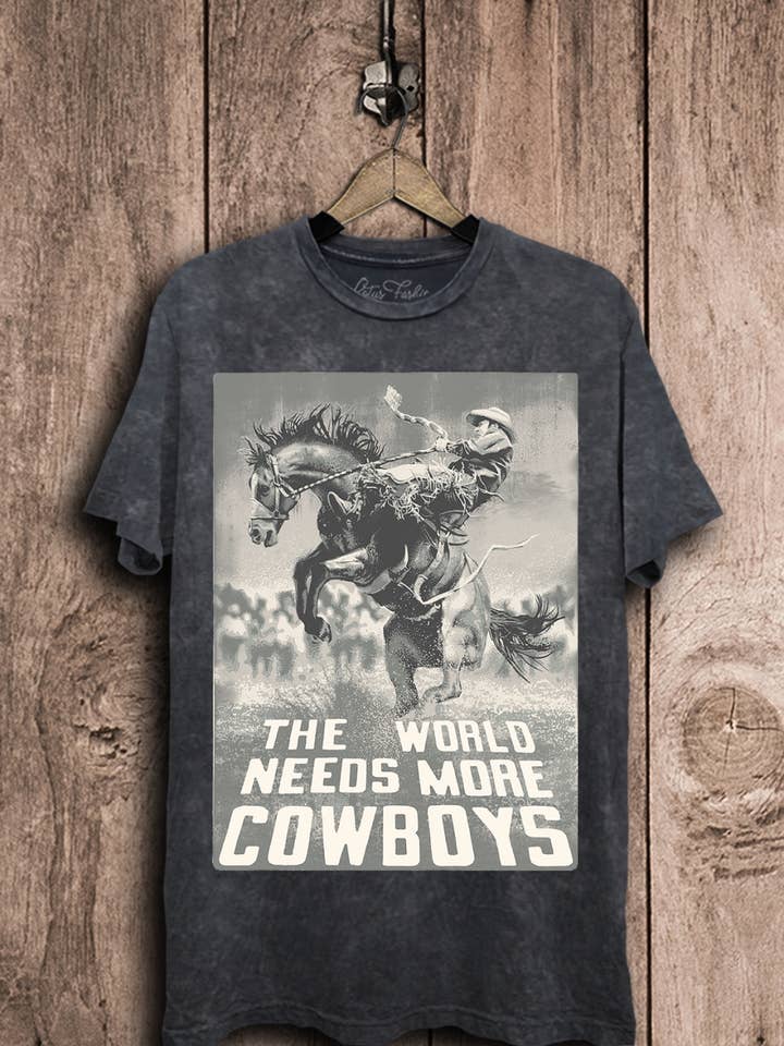 The World Needs More Cowboys Graphic Top for wholesale by Lotus Fashion Collection