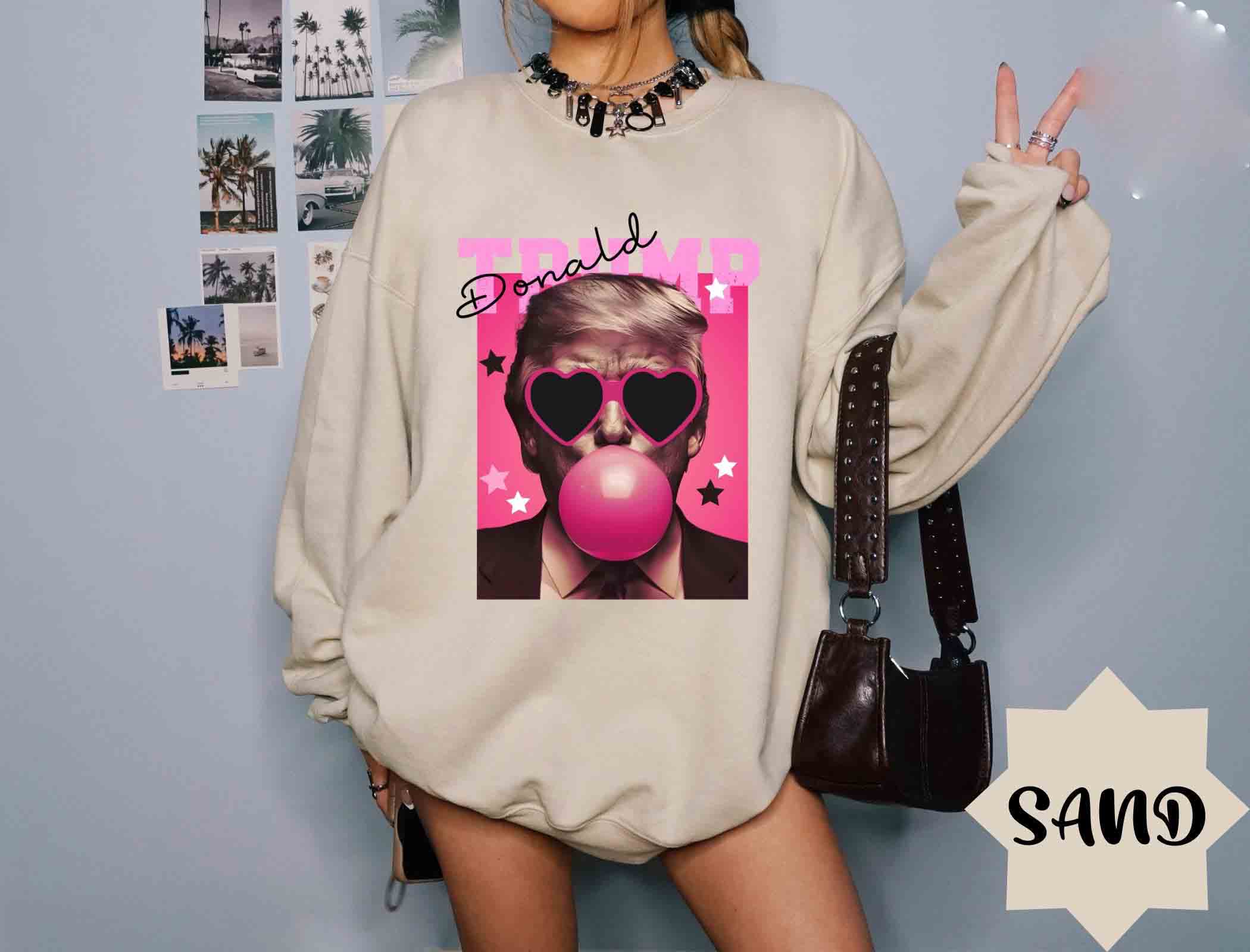 NVC Ecommerce LLC - Wholesale T-Shirt (Graphic) - Women's - Trump Bubble Gum Shirt, Trump Pink Sun Glasses Sweatshirt1