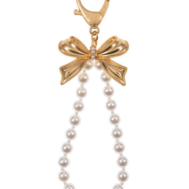 Vintage Gold Gold Bow With Cream Pearl Bag Charm Keychain for wholesale on Faire2