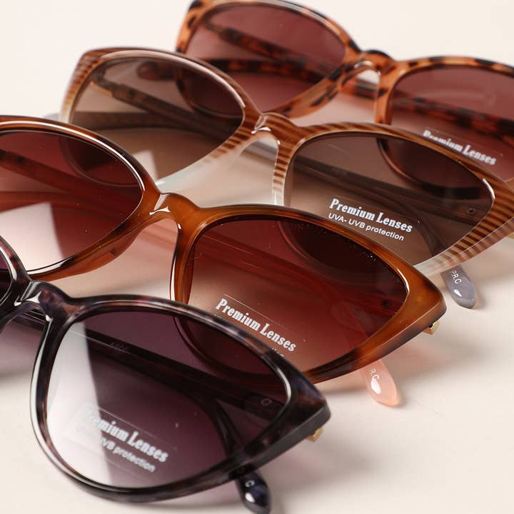 12 COLORI ASSORTITI Occhiali da sole a forma di triangolo Cat Eye con montatura in vendita all'ingrosso su Faire4