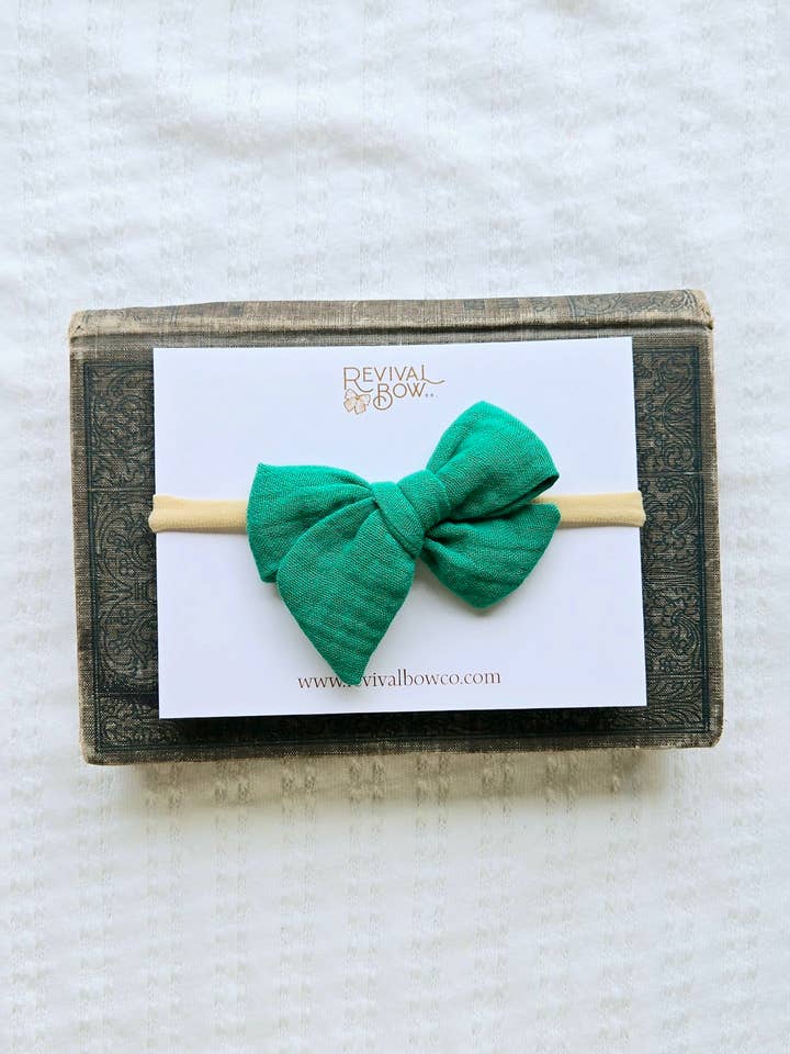 Small Pinwheel Bow on Headband • Shamrock Green Gauze for wholesale by Revival Bow Co.