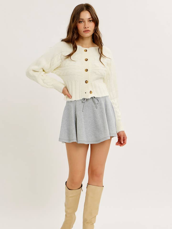 CREAM ELEVATED CABLE KNIT BUTTON-DOWN SLIM-FIT CARDIGAN for wholesale on Faire0