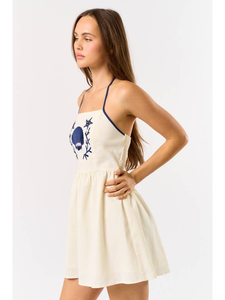 OFF WHITE NAVY IBD33506 LINEN SEASHELL EMBROIDERY HALTER MINI DRESS for wholesale on Faire