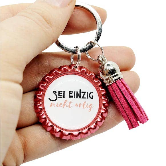 Key ring in a bottle cap - saying just be not good - pendant for wholesale by Happy Crowns