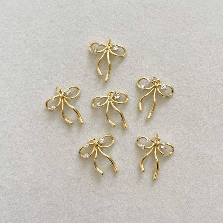 Goldie Charm Bar - Vente Breloques/médailles personnalisées - CHARM NŒUD ÉCLATANT