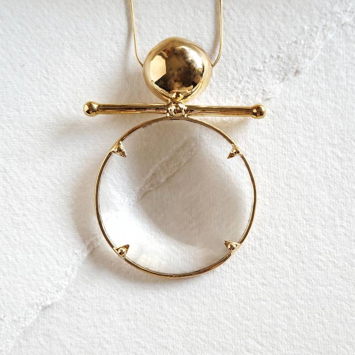 Brass magnyfying glass statement pendant necklace for wholesale by Bisjoux