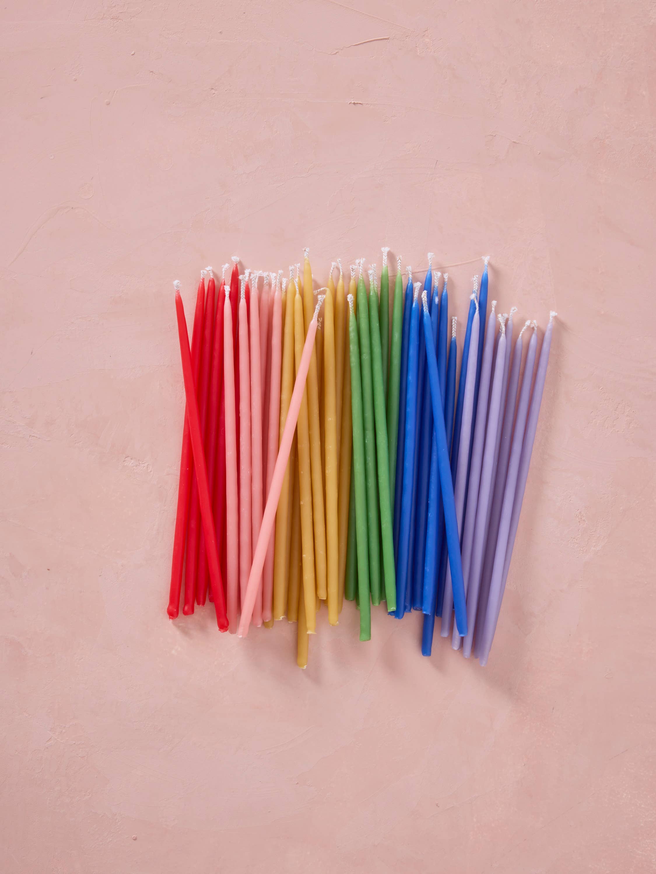 Hand-dipped Pure Beeswax Birthday Candles | Tall Rainbow for wholesale on Faire2