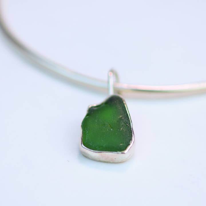 Sterling silver bangle with green sea glass charm for wholesale by Louella Jewellery