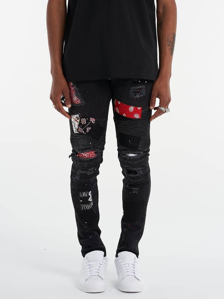 Jean noir déchiré à empiècements Biker pour la vente par UNEFFECTED STUDIOS