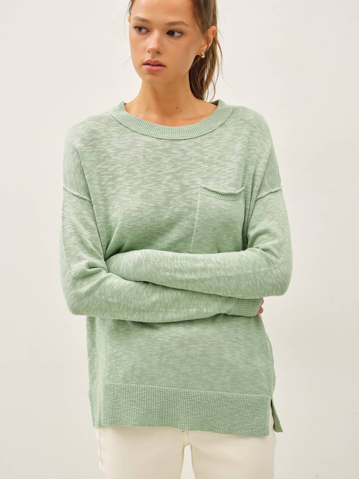 PULL À COL ROND EN FIL FLAMMÉ AVEC POCHES POITRINE pour la vente par Be Cool