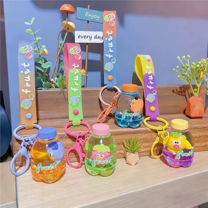 Juego de 12 llaveros flotantes con forma de botella de refresco para venta al por mayor de Bewaltz