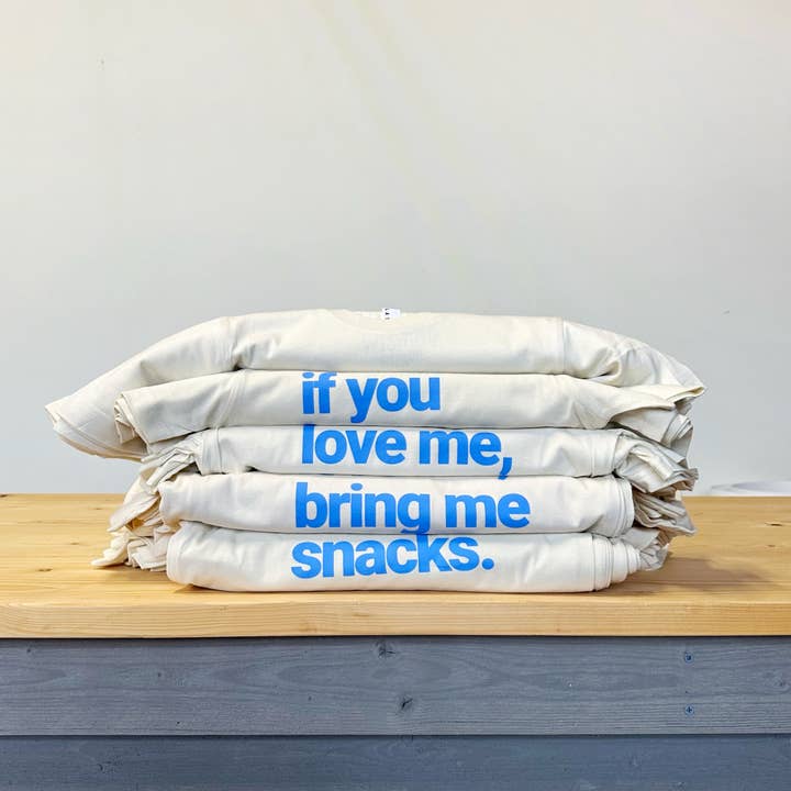 If you love me, bring me snacks Tee for Kids and Adults for wholesale by The Wishing Elephant