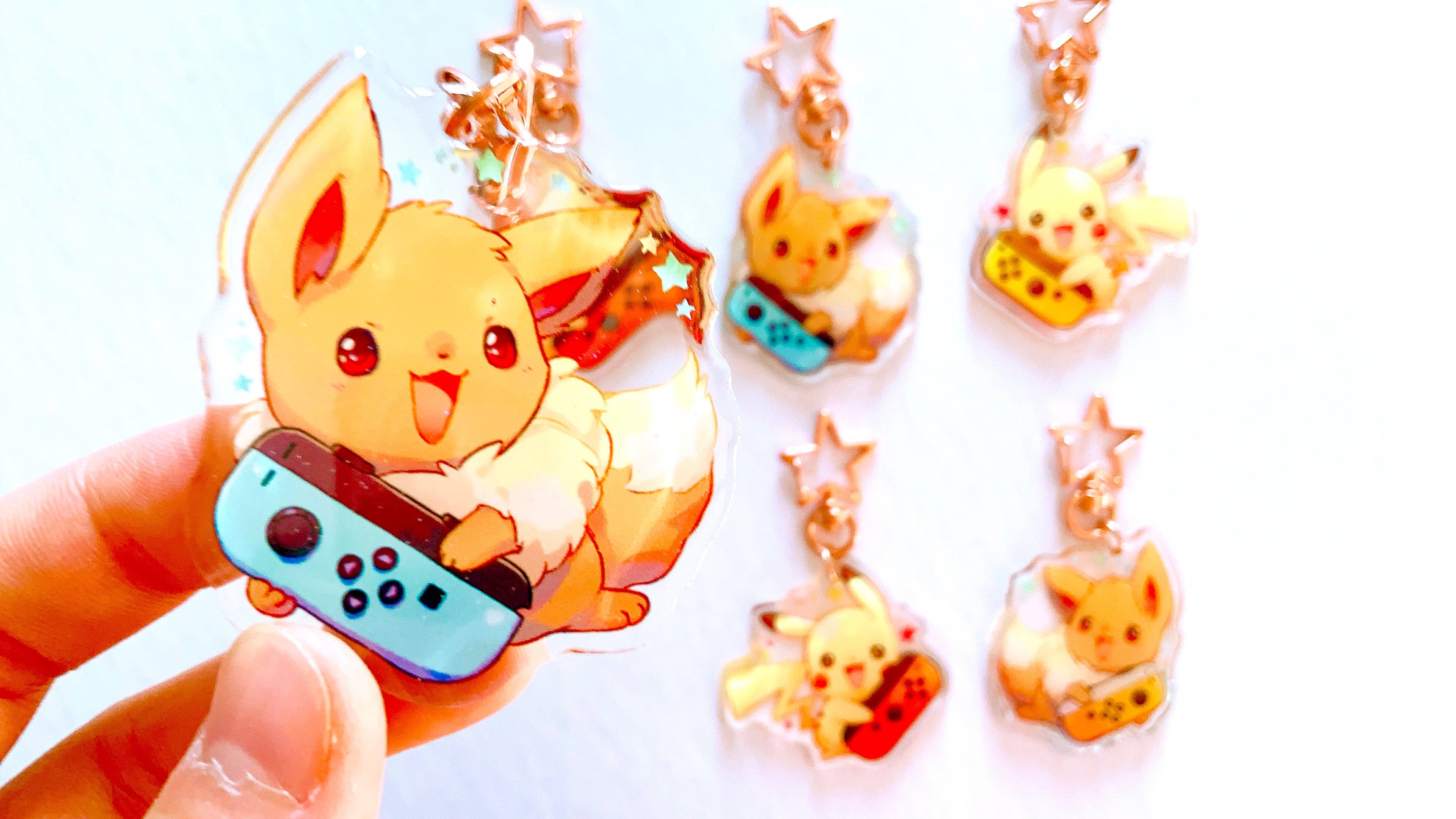ToasterKiwi - Wholesale Keychain - Unisex - Pikachu Eevee Nintendo Switch Charms (2.5 inch Clear Acrylic)4
