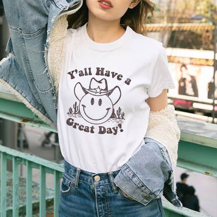 Maglietta con faccina felice da cowboy occidentale - Buona giornata a tutti voi per la vendita all'ingrosso da parte di Achitopia