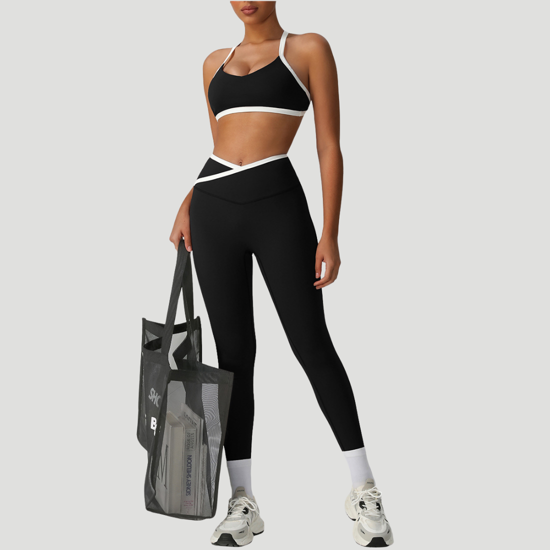 Sodalemon - Vendita all'ingrosso Completo sportivo - Donna - Set due pezzi con reggiseno incrociato e pantaloni sportivi a vita alta1