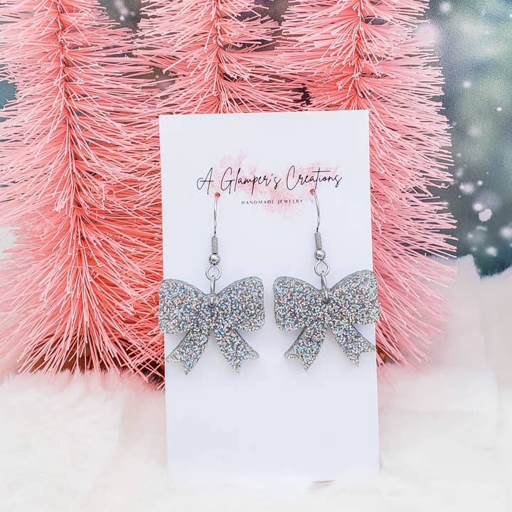 Silver Iridescent Christmas Bow Acrylic Earrings for wholesale by A Glamper's Creations LLC