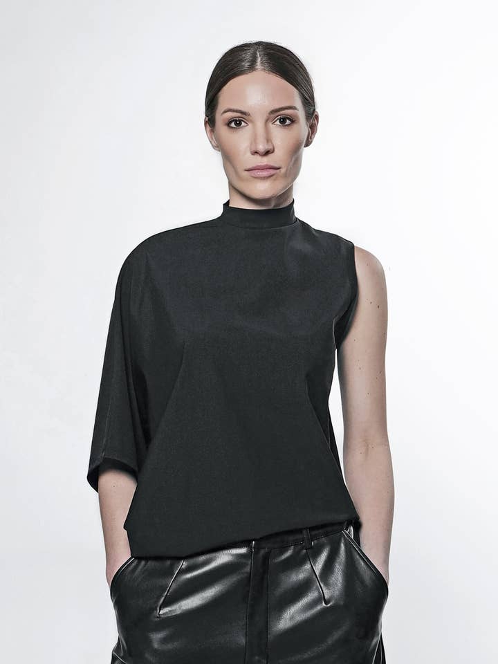 La parte superiore irregolare per la vendita all'ingrosso da parte di Article X