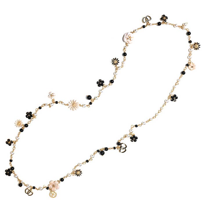 LONG NECKLACE OF PEARLS AND STONES WITH FLOWERS AND HEARTS for wholesale by AMORINO SRL