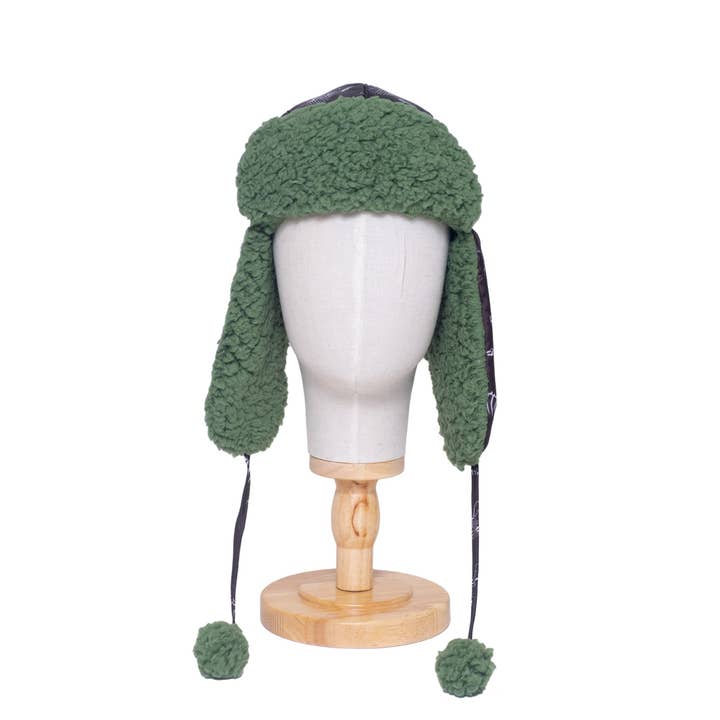 The Cozy Trapper – Dino Bones Print with Katydid Green Sherpa Liner & Pompoms for wholesale by Mimish