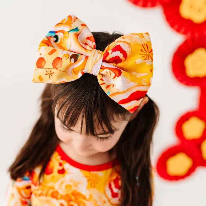 Løvedansere Bowtiful Hårbånd for engroshandel hos Dreambly Me