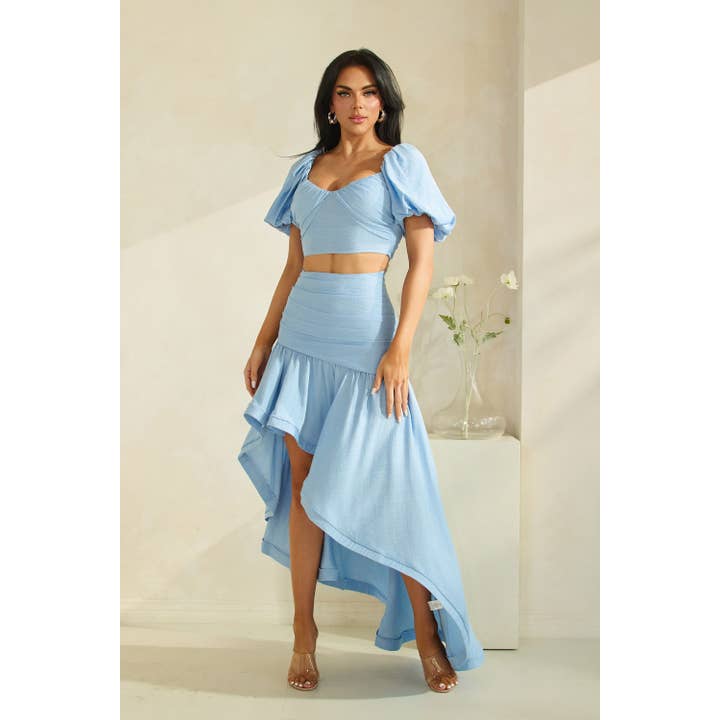 TOP CURTO COM DECOTE EM V E MANGAS BUFANTES COM SAIA MAXI DE BAINHA ASSIMÉTRICA. por atacado de The Sang