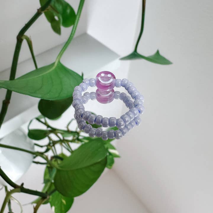 Lilac glass pearl ring with purple smiley for wholesale by cool people club