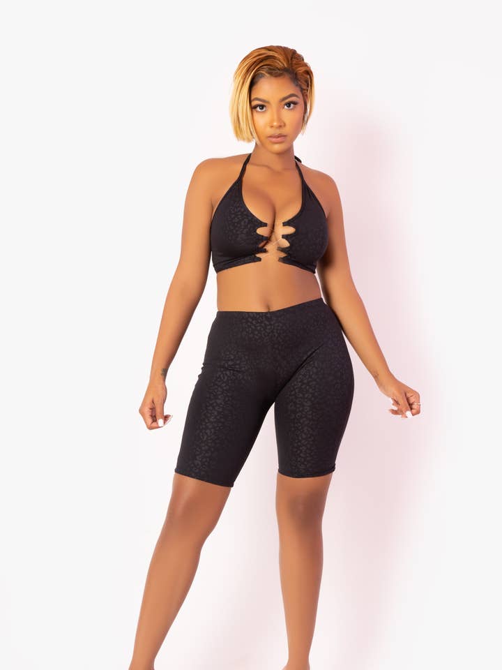 Conjunto de top infinito invisible de leopardo negro con pantalón corto de motero para venta al por mayor de Playsuit Apparel