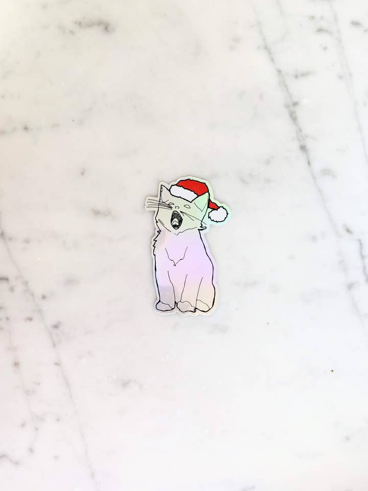 Holographic Yawning Christmas Kitten Sticker for wholesale by Madeleine Sywulak US