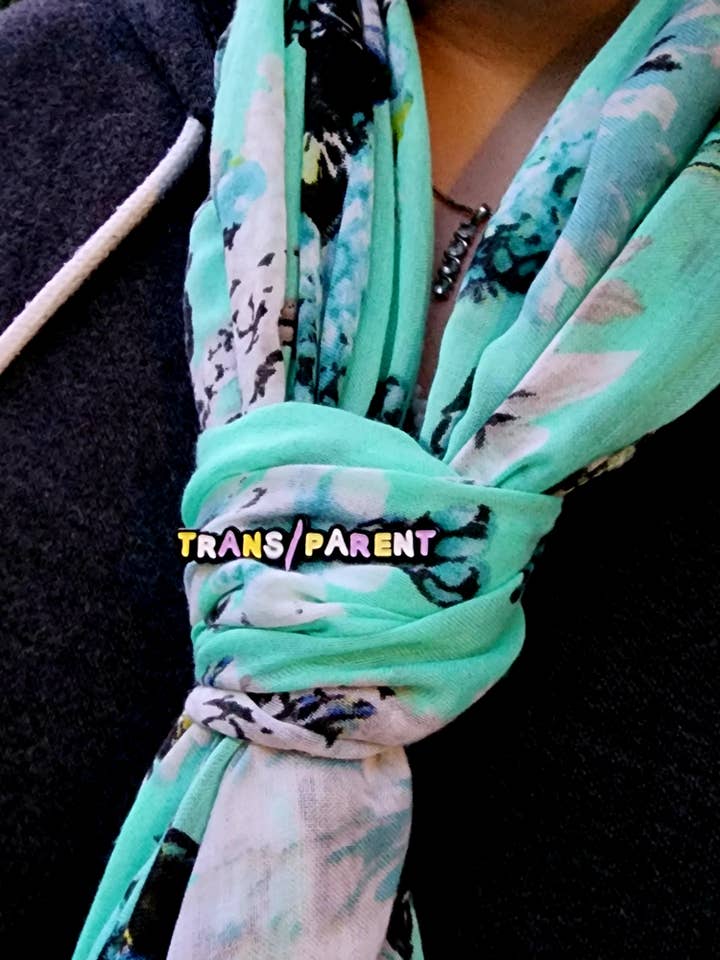 Transparent Nonbinary Parent Enamel pin for wholesale by Arledge Comics