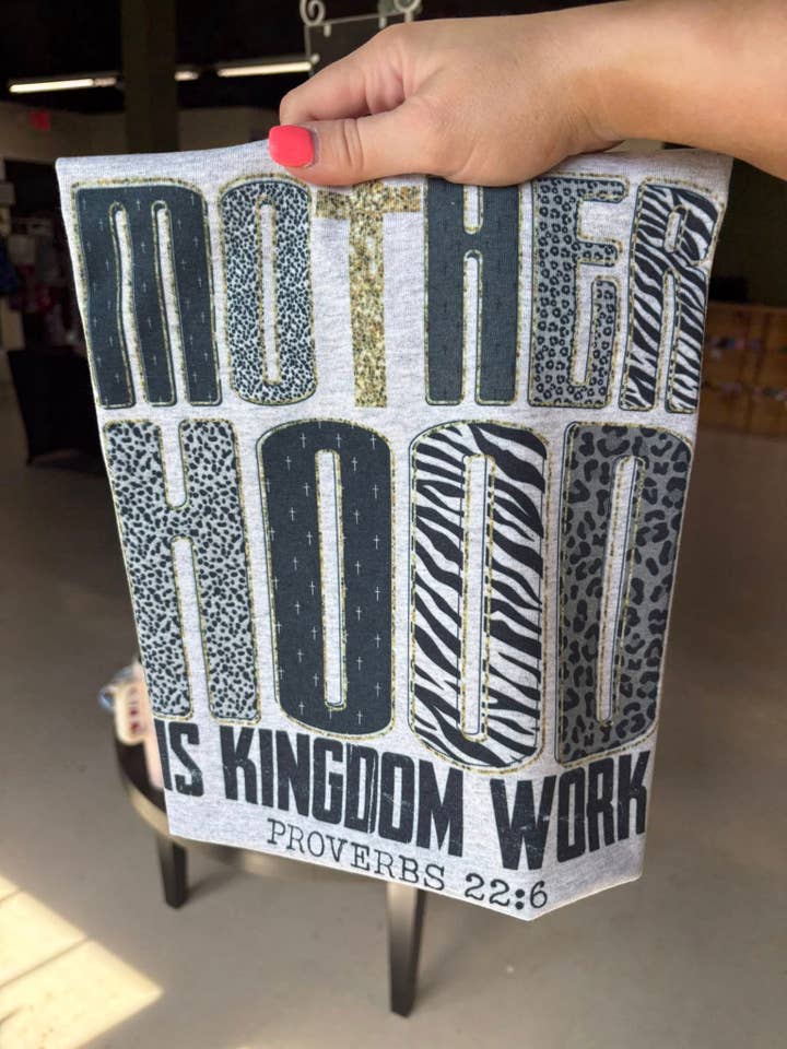 Motherhood is Kingdom Work Sublimation T-Shirt for wholesale by Honey Kate’s Apparel Co.
