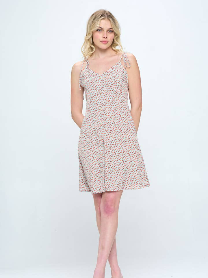 ALL OVER HEART PRINT SPAGHETTI STRAP DRESS WITH POCKETS for wholesale by SM WARDROBE