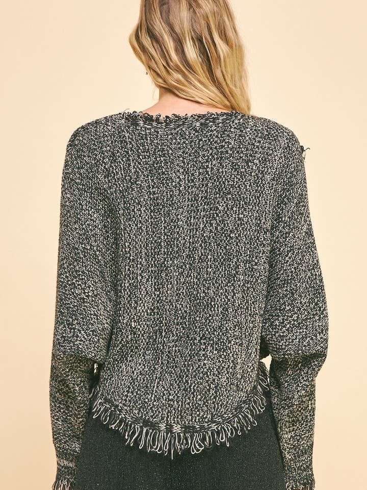 Grey Black OVERLAPPING ASYMMETRICAL FRINGED HEM CROP SWEATER for wholesale on Faire