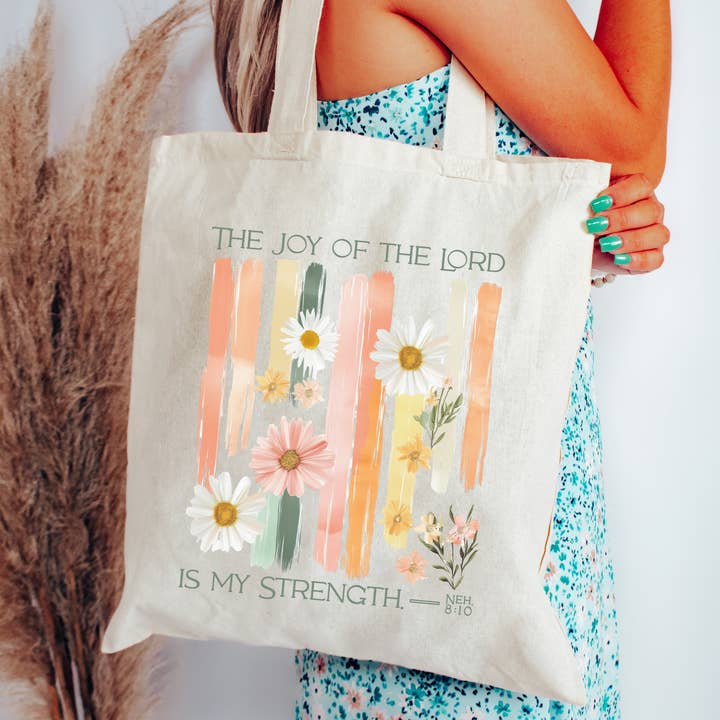 The Joy of the Lord Floral Scripture Canvas Tote Bag for wholesale by Scripted Pearl