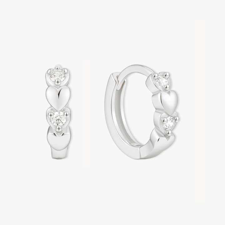 CZ Heart Huggie Hoops In Silver for wholesale by LEA Jewels