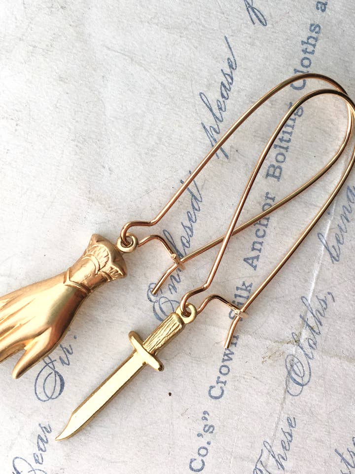 Hand Dagger Earrings Whimsical Goth MFM Murderino Earrings for wholesale by Red Truck Designs