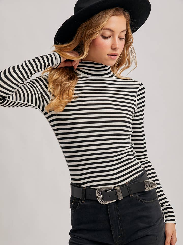 STRIPED TURTLENECK KNIT TOP and other Purchase Wholesale black turtleneck. Free Returns & Net 60 Terms on Faire trending on Faire.