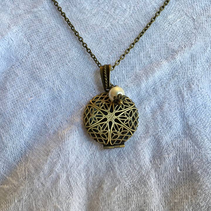 Filigree Round Locket Necklace for wholesale by The Atlas Rose And Key