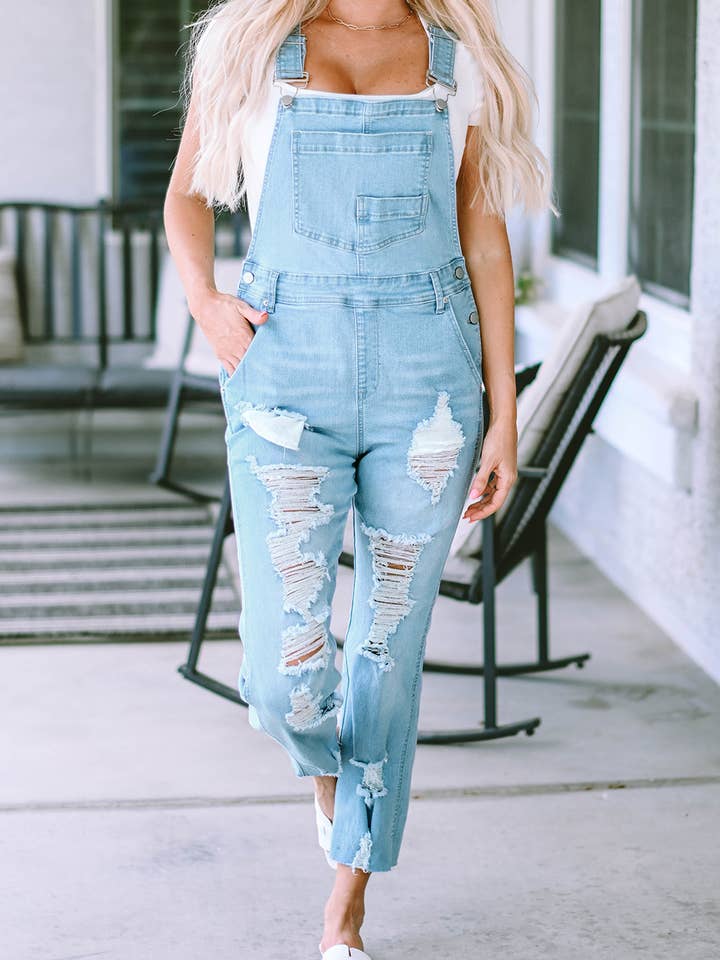 Salopette en jean vieilli à poches à bretelles pour la vente par Umorger