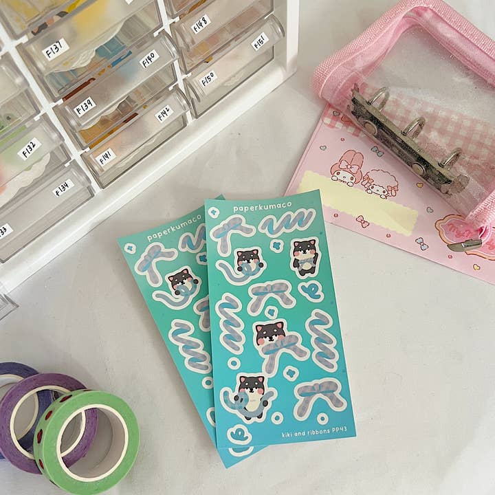 Kiki and Ribbons Shimmer Sticker Sheet for wholesale by Paperkumaco