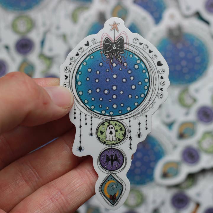 ‘Spooky Hanging’ Vinyl Sticker for wholesale by The Attuned Cauldron LLC