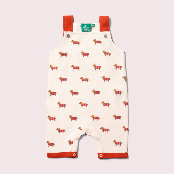 Cream Sausage Dogs Storytime Dungaree Shorts for wholesale by Little Green Radicals