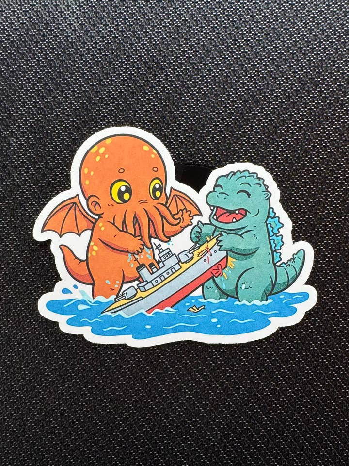 Baby Cthulu With Baby Godzilla Sticker for wholesale by thegloomycottage