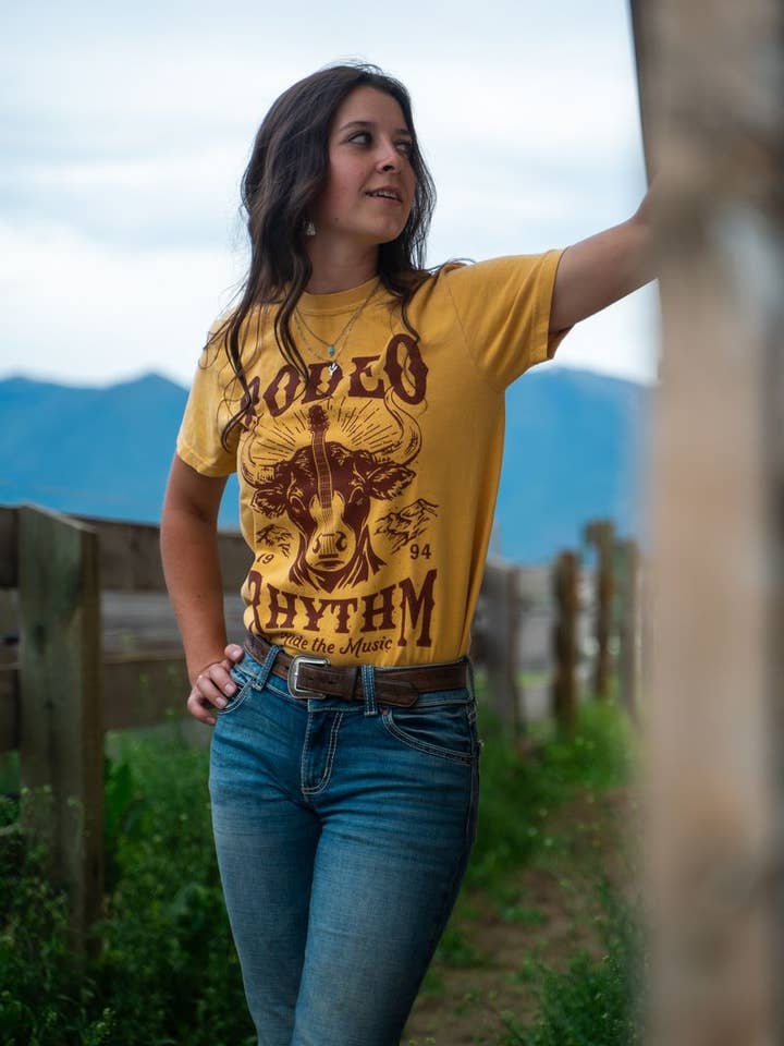 The Montana Scene - Wholesale Screen Printed T-Shirt - Women's - Rodeo Rhythm Unisex Tee - Mustard